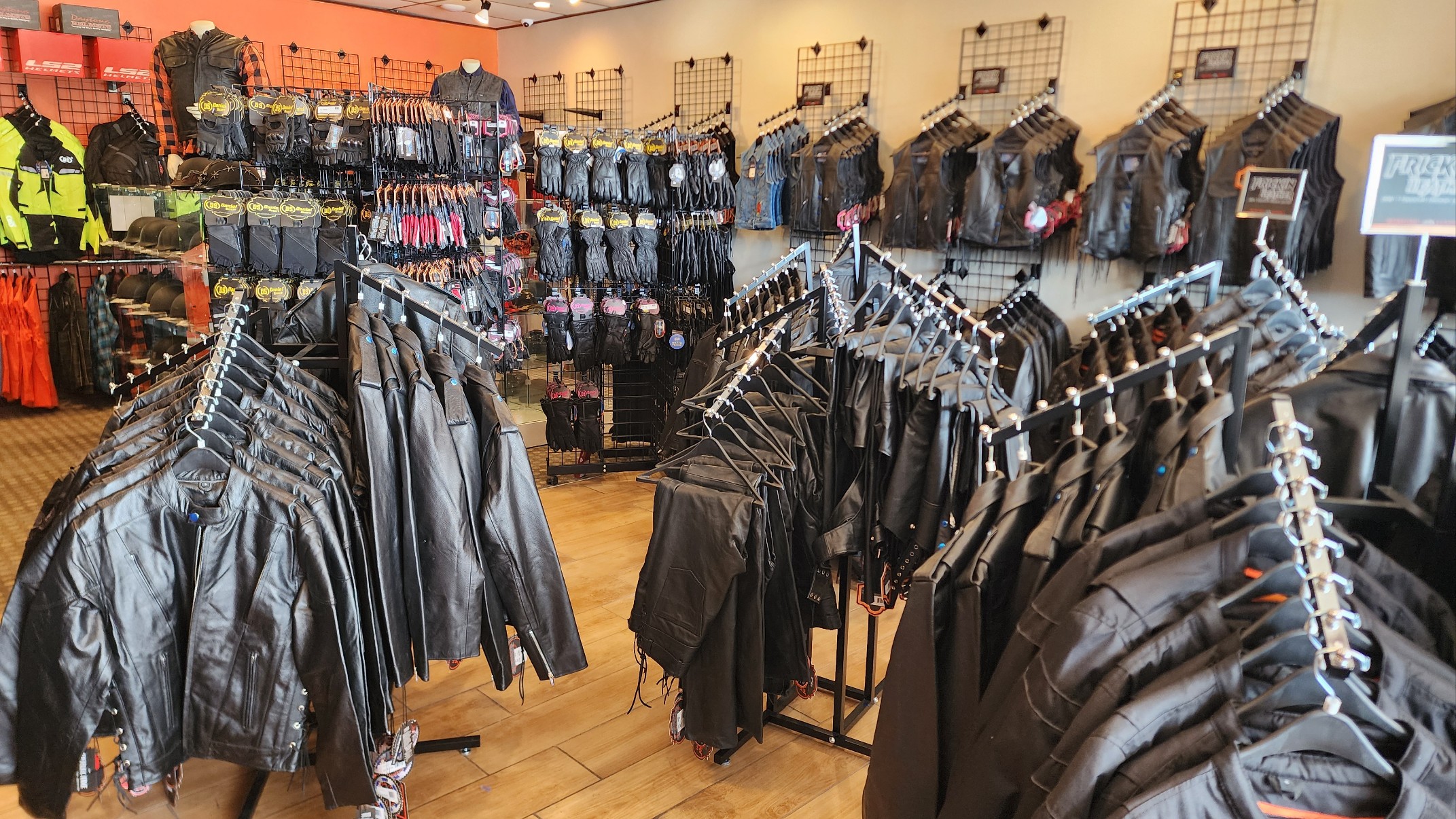 Motorcycle leather jackets and riding gear display inside Renegade Classics Kansas City store